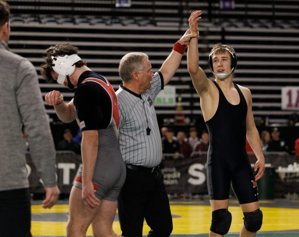 Riverside’s Peter DesRoches walks off in tears after he lost to Mount Baker’s Daniel Washburn after the match was called for DesRoches exceeding a blood time limit Saturday, Feb. 17 during Mat Classic XXXV at the Tacoma Dome.