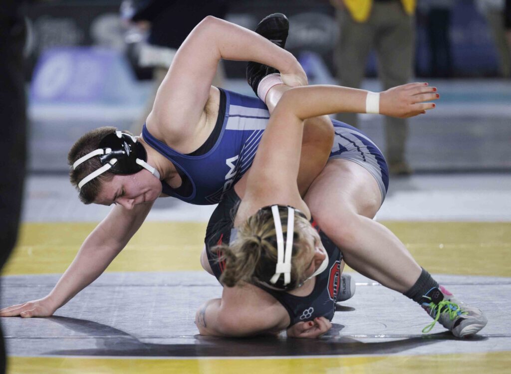 Bella Phillips flips their opponent during the state title match.