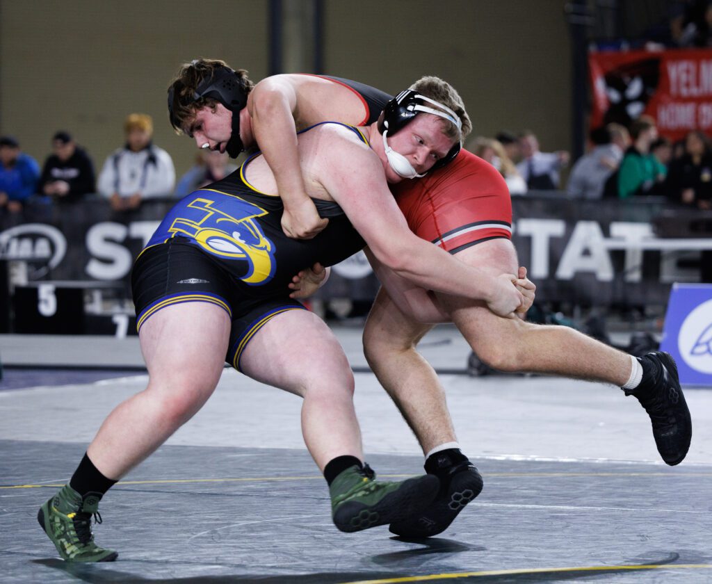 Ferndale’s Wyatt Strait tries to take down Yelm’s Jonah Smith in the 3A/4A 285-pound state title match. Strait lost 9-2.
