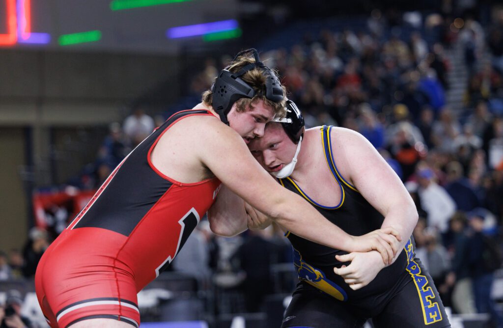 Ferndale’s Wyatt Strait battles for hand control with Yelm’s Jonah Smith during the 285-pound state title match.