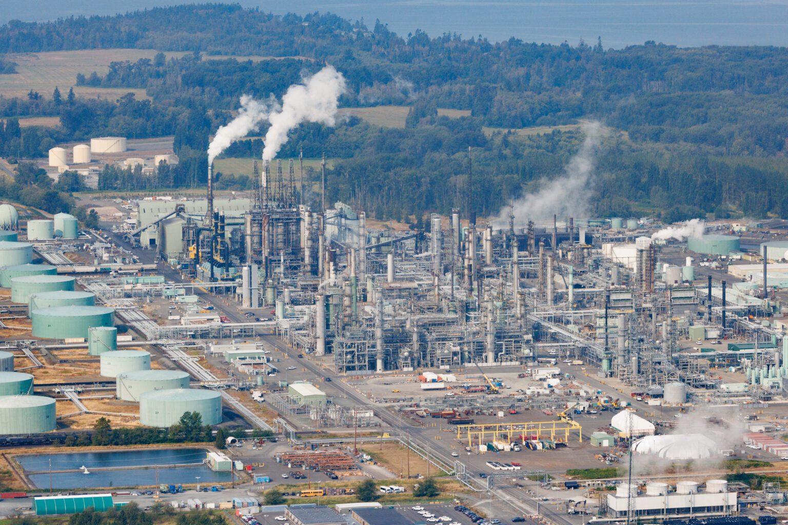 An aerial view of BP Cherry Point Refinery with smoke fumes coming out.