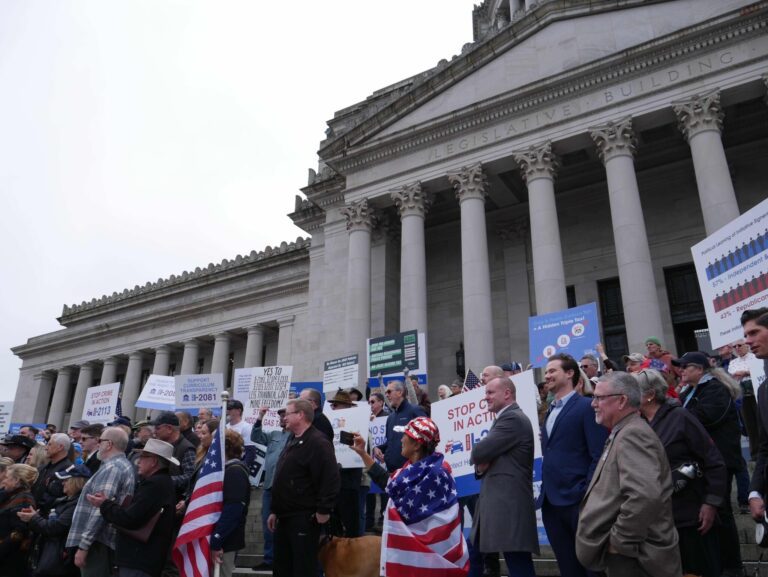 Supporters of the six citizen initiatives pending before the Legislature in the 2024 session gather outside the state Capitol building on Friday, Feb. 23.