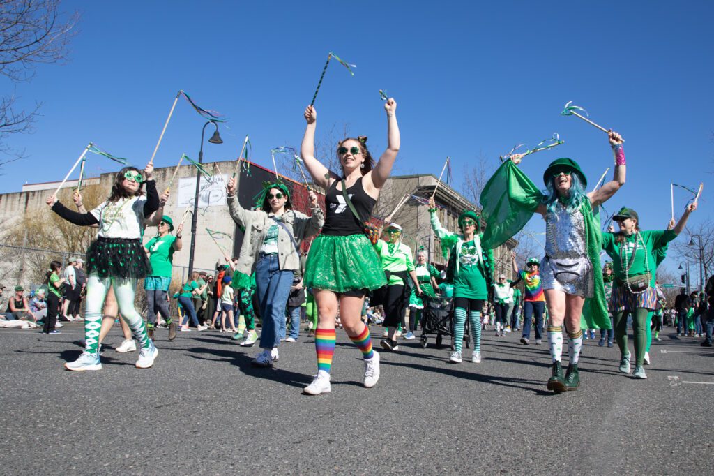 Folks wave streamers as they walk through the Bellingham St. Patrick's Day Parade Sunday, March 17 on Railroad Avenue.