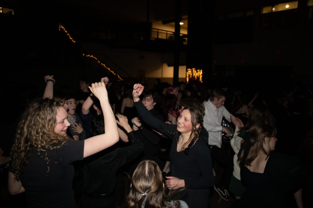 Students dance to Chrvns' performance.
