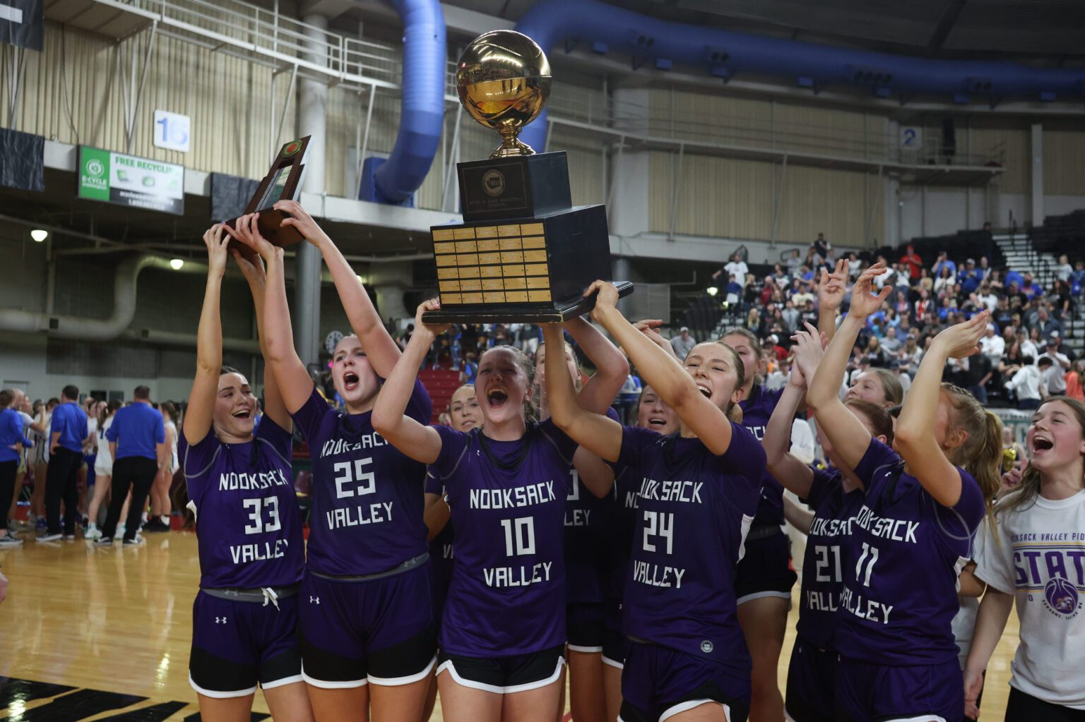 Nooksack Valley celebrates after beating Deer Park, 70-67, on Saturday, March 2 to clinch back-to-back state titles at the Yakima Valley SunDome.