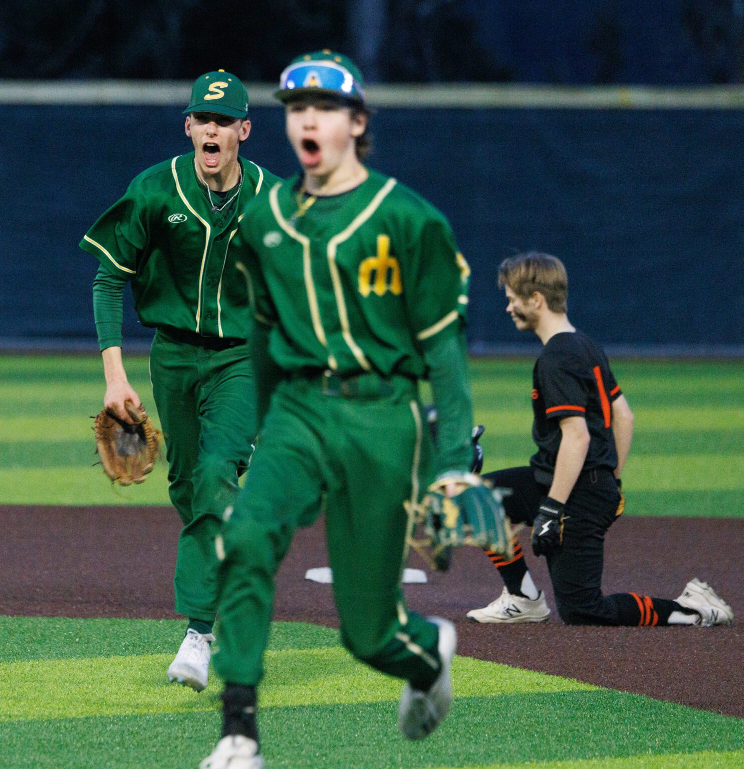 After making double play to end the game Thursday, March 21, Sehome’s Ryder McGrath, left, and Gunnar Tweit celebrate as the Mariners held on to beat Blaine 4-3 at Sehome High School.
