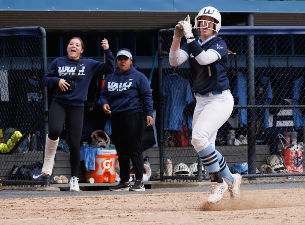 Western Washington University's Hailey Rath skips and hops to home plate after hitting a three-run homer Saturday, March 30 as the Vikings beat Saint Martin's University 7-1 in the first game of a doubleheader at Viking Field.