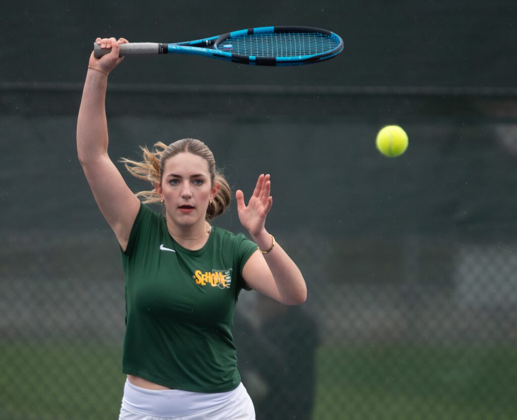 Sehome senior Claire Stodola returns a hit Wednesday, April 24 during a home match against Lynden.