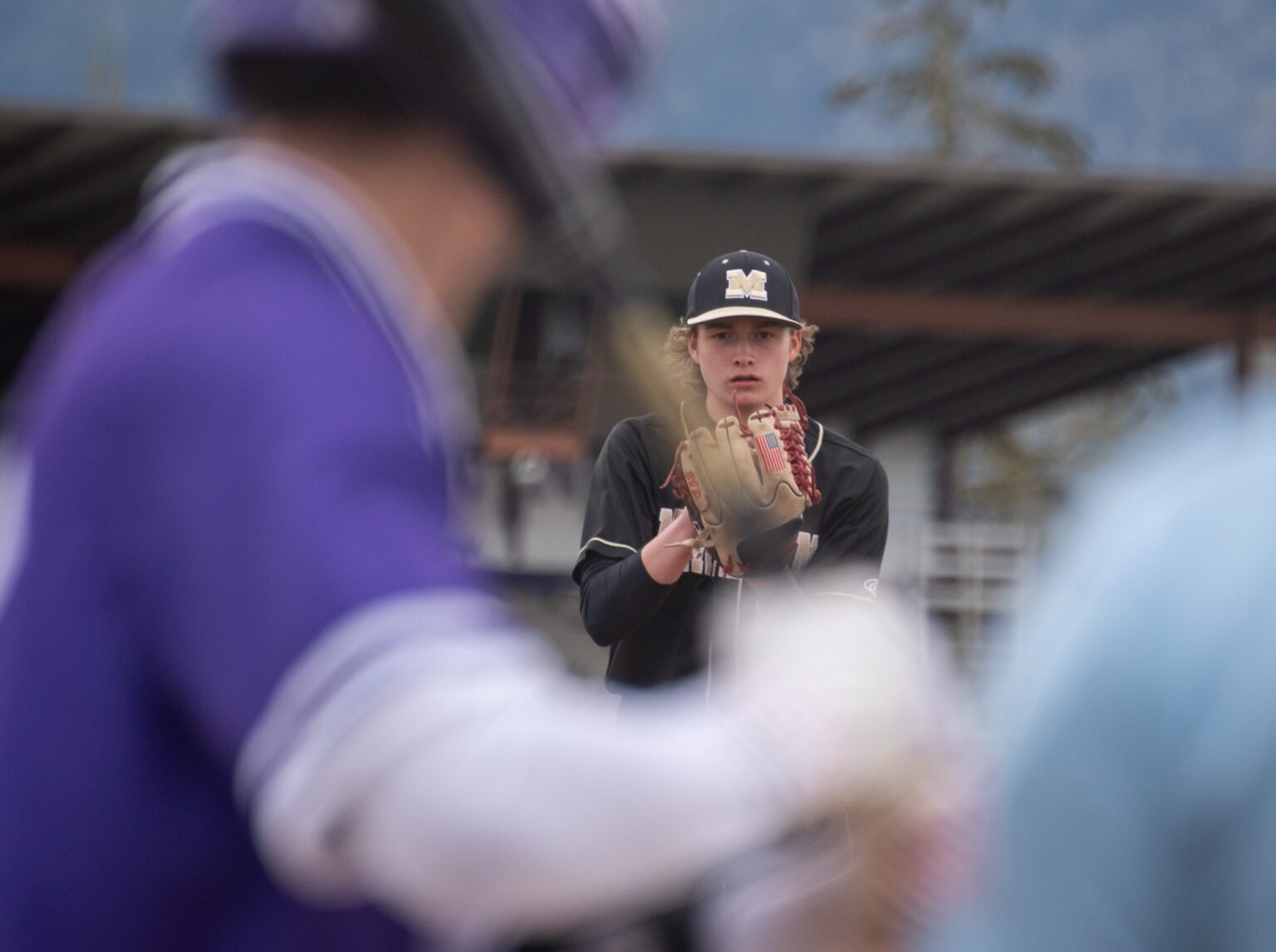 Meridian freshman pitcher Nate Payne stares down a Nooksack Valley batter Tuesday, April 2 in the first inning of the Trojans' 5-1 win in Everson. Payne tossed a complete game.