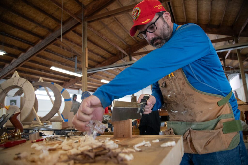 Mark Martinez saws a piece of wood during a demo on Saturday, April 6 during the Skagit Wood Expo and Marketplace at the Skagit County Fairgrounds.