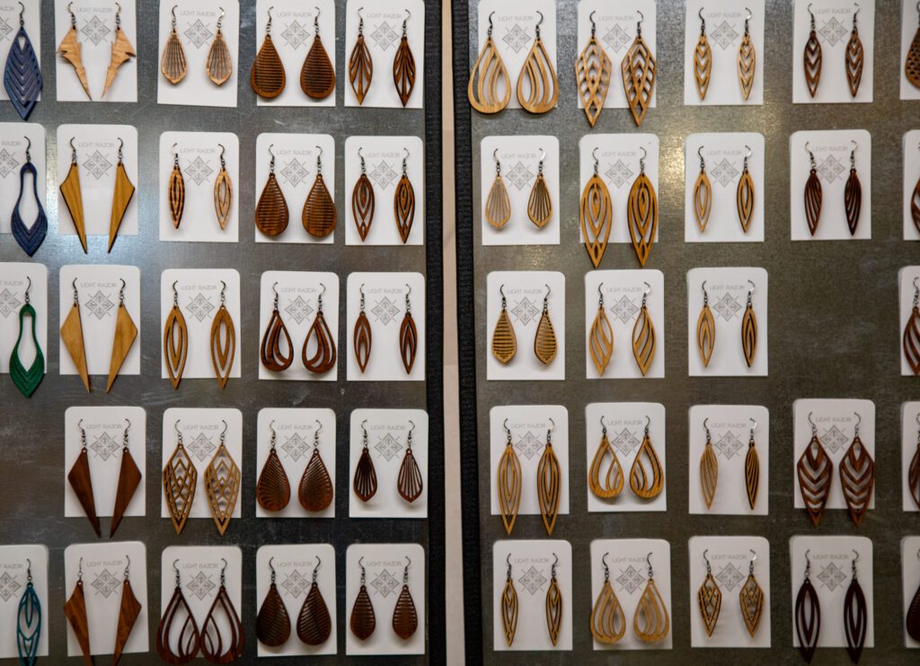Light Razor Design Studio offered dozens of intricately carved wood earrings.