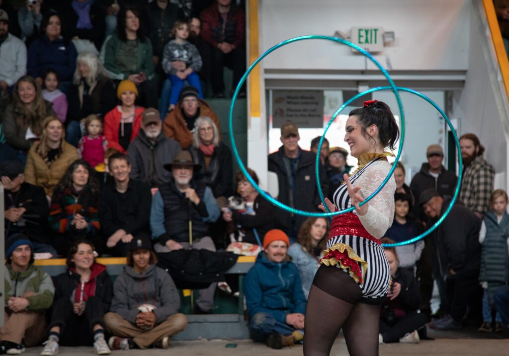 Natale Luma from the troop Cirque Cadia spins hula hoops in front of a packed crowd. The expo included a circus show which attracted artists from around the region, including Luma who can be found performing at the Bellingham Circus Guild.