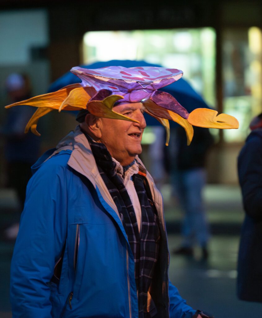 A man wears a lighted crab hat during the parade.