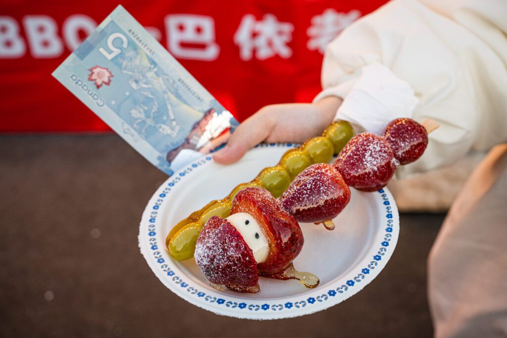Tanghulu is a traditional Chinese snack consisting of fresh fruit coated in rock sugar on a bamboo skewer.