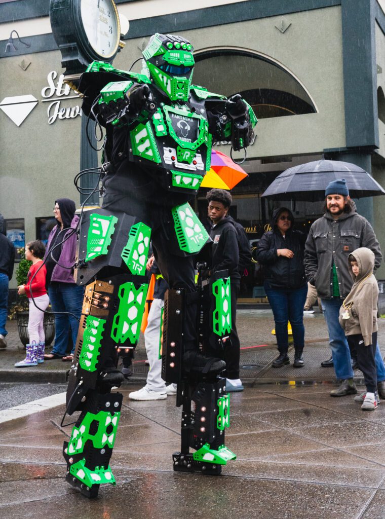 The rain failed to short circuit the robot from Sonido Fantasma who joined the parade.
